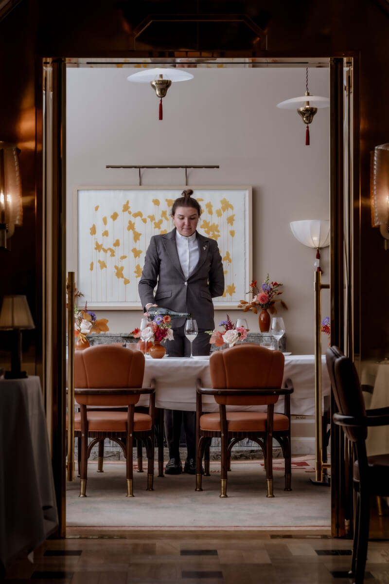 Sommelier serving wine in Claridge's Restaurant private dining room